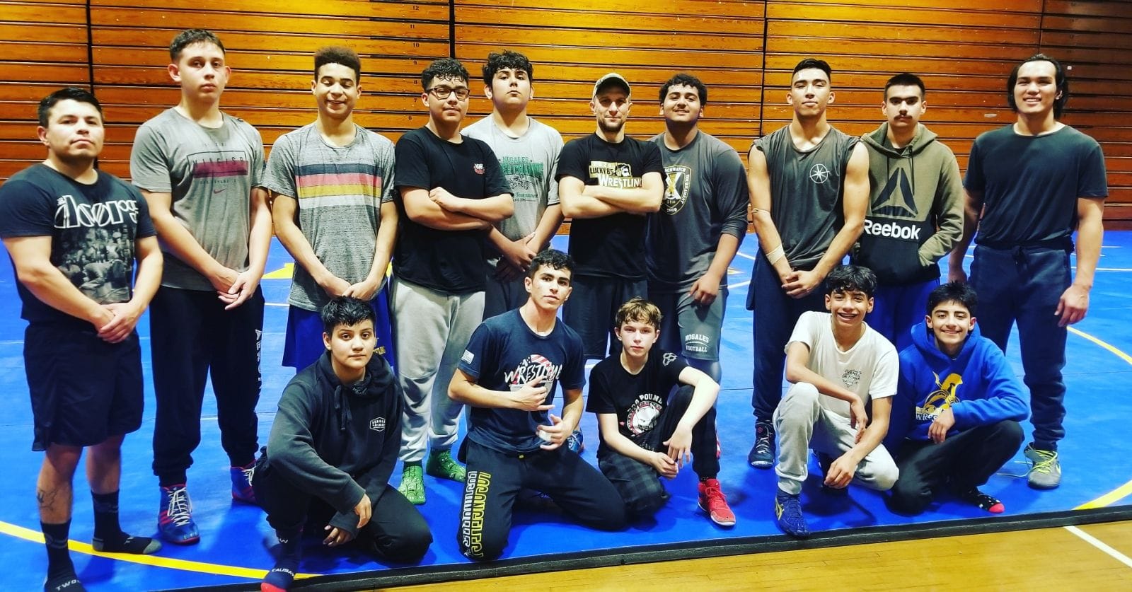 Savage House wrestlers lined up on the mat